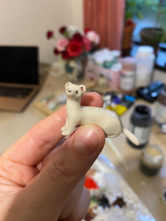 Snow weasel sculpture